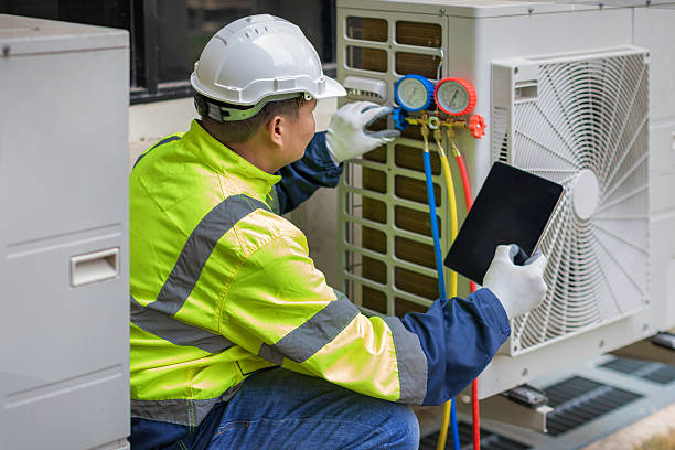Professional Hvac technician working in Palmerdale, AL